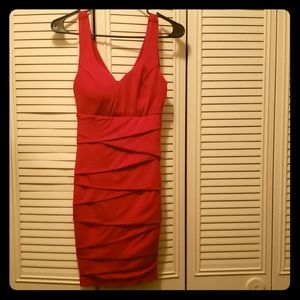 Low cut red dress.